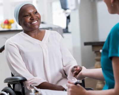 cancer-patient-with-head-scarf-sitting-in-wheelchair